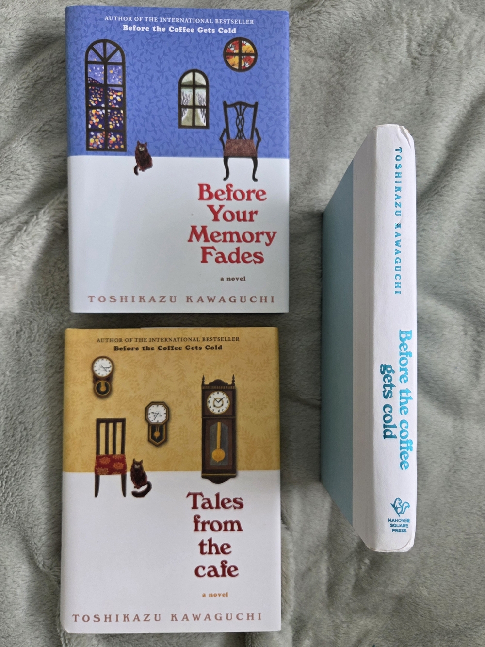 three hardcover novels from the Before the Coffee Gets Cold series by Toshikazu